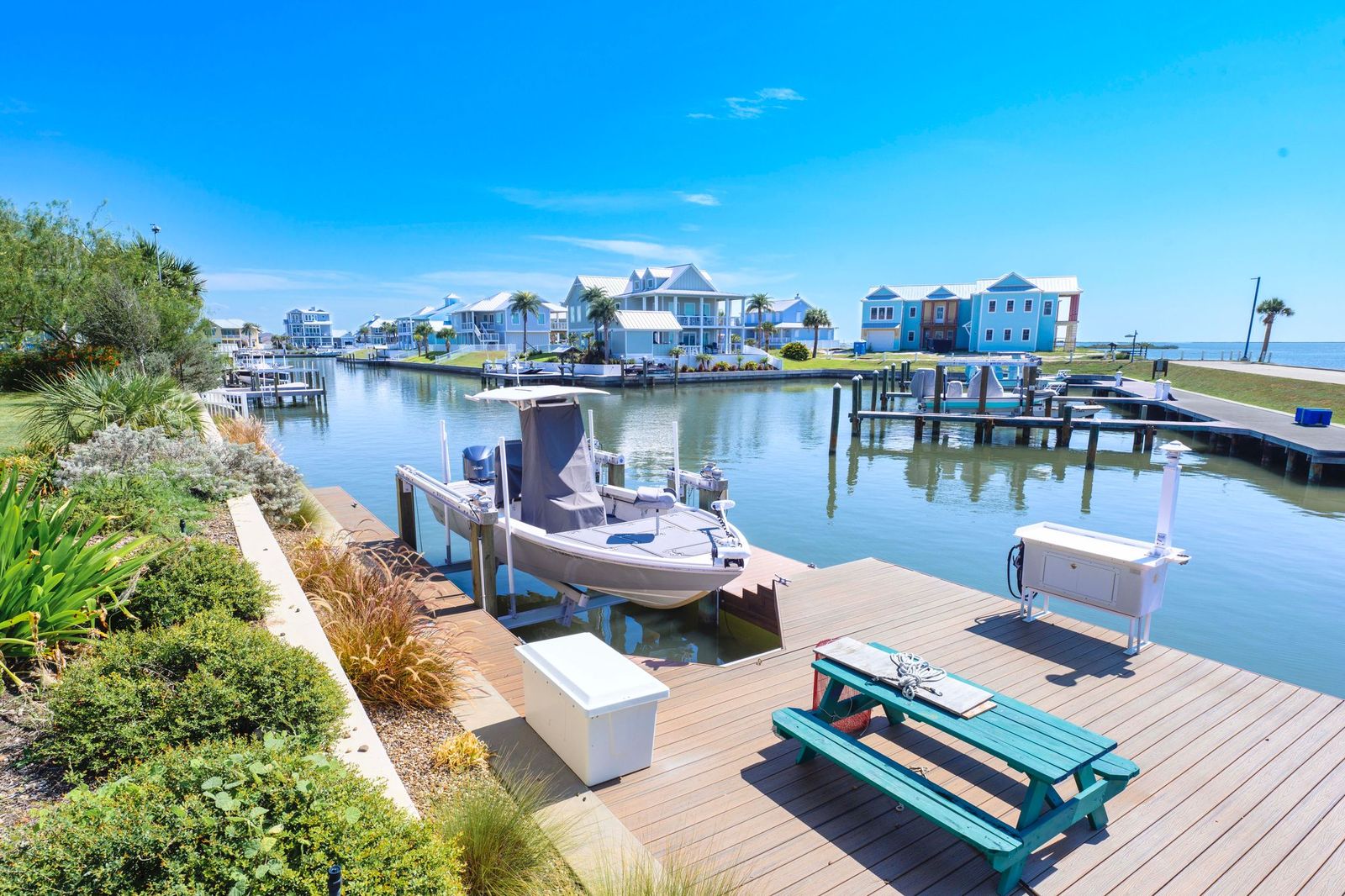 Attached boat slip with nautical themed outdoor furniture