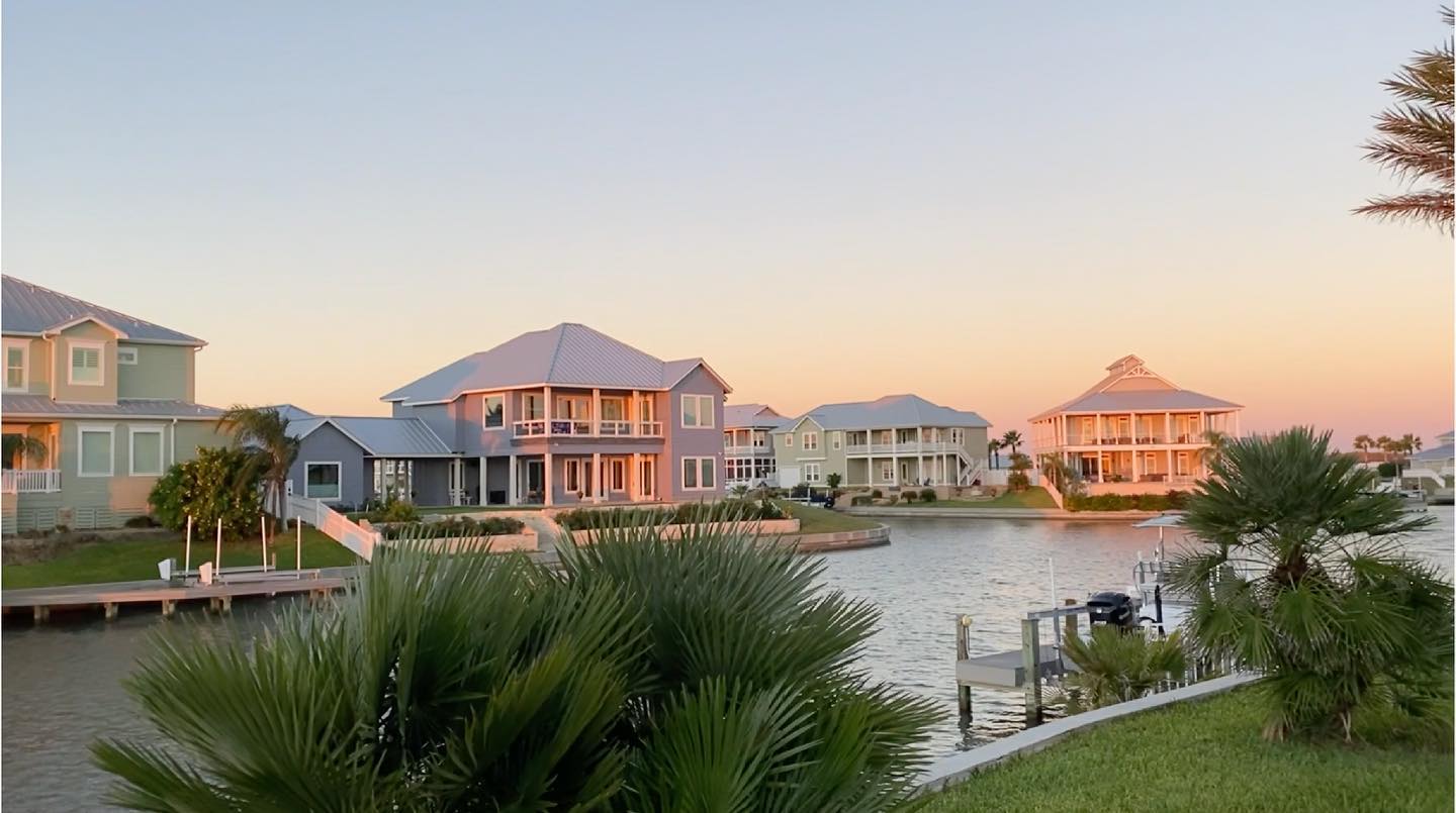 Waterfront home lots during early sunset on Rockport, TX bay